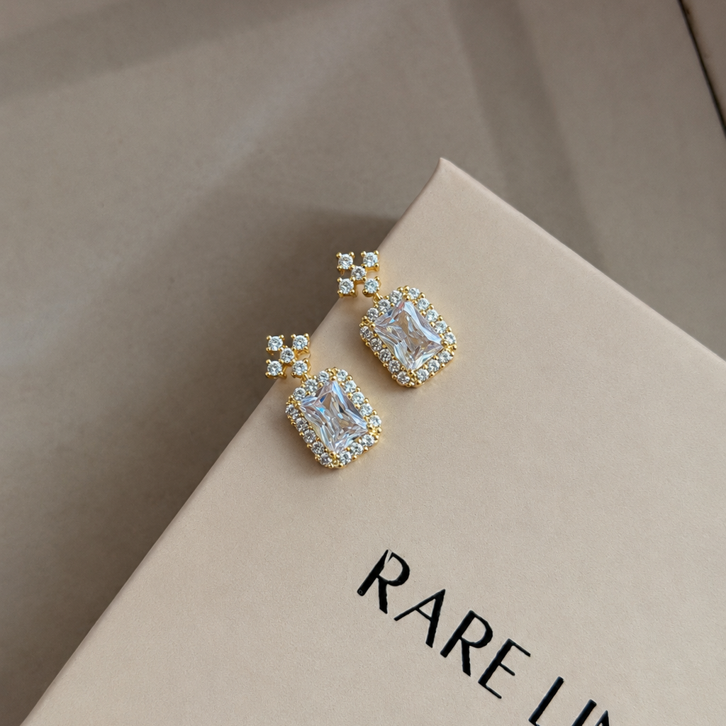 Oriah Emerald Cut Halo Cross Earrings